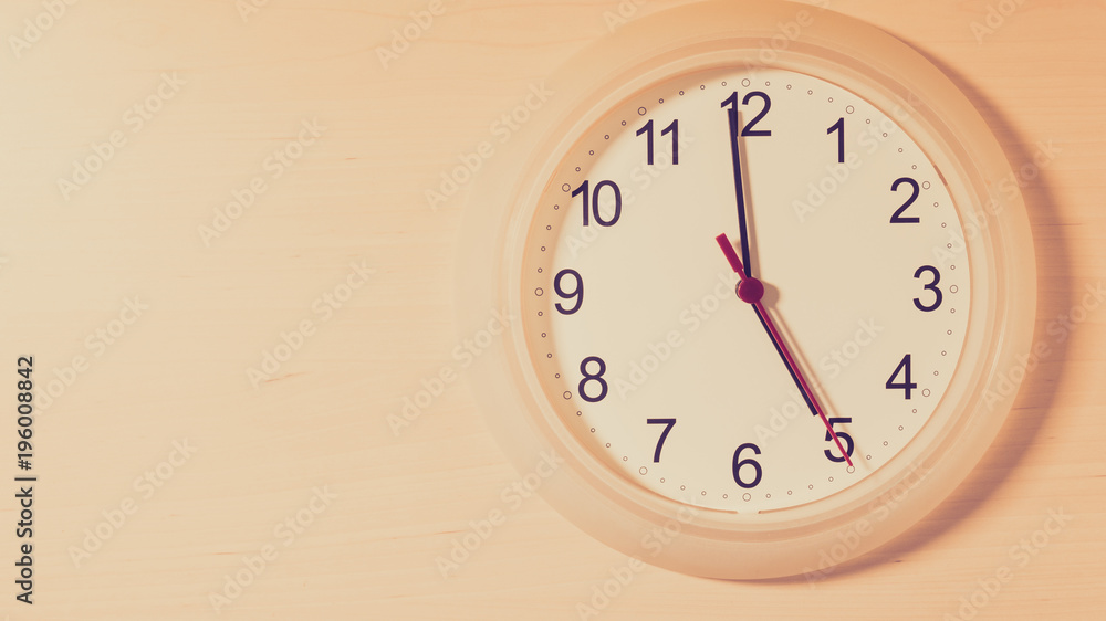 Clock ticking showing five hours Clock ticking showing five hours