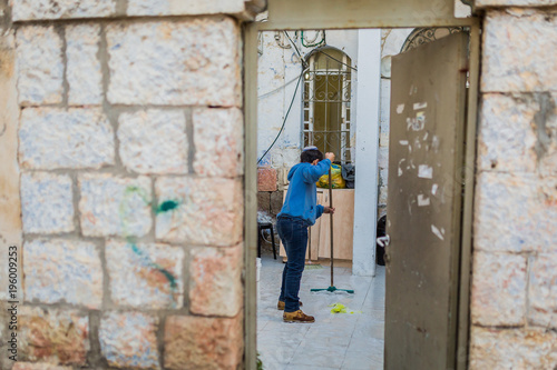 jewish boy cleaning the floor in Jerusalem, Israel © Dennis
