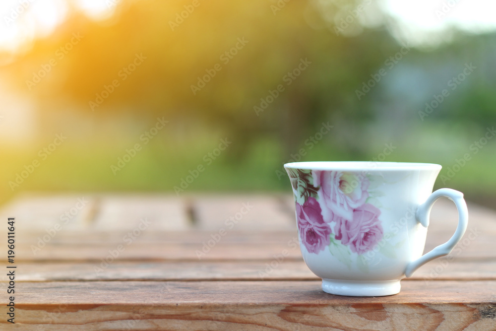 hot coffee with classic cup on nature background hot coffee with classic cup on nature background