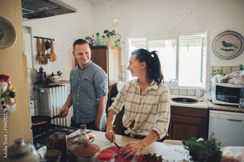 Let's cooking love. Romantic breakfast. Young couple at the kitc