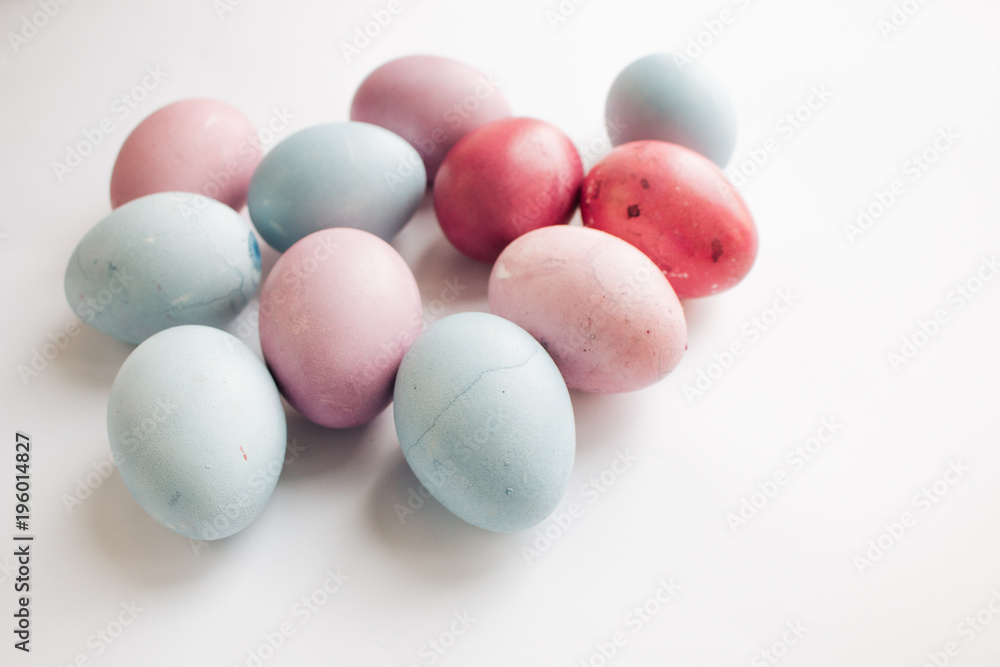 Painted Easter eggs on white background, festive background Painted Easter eggs on white background, festive background