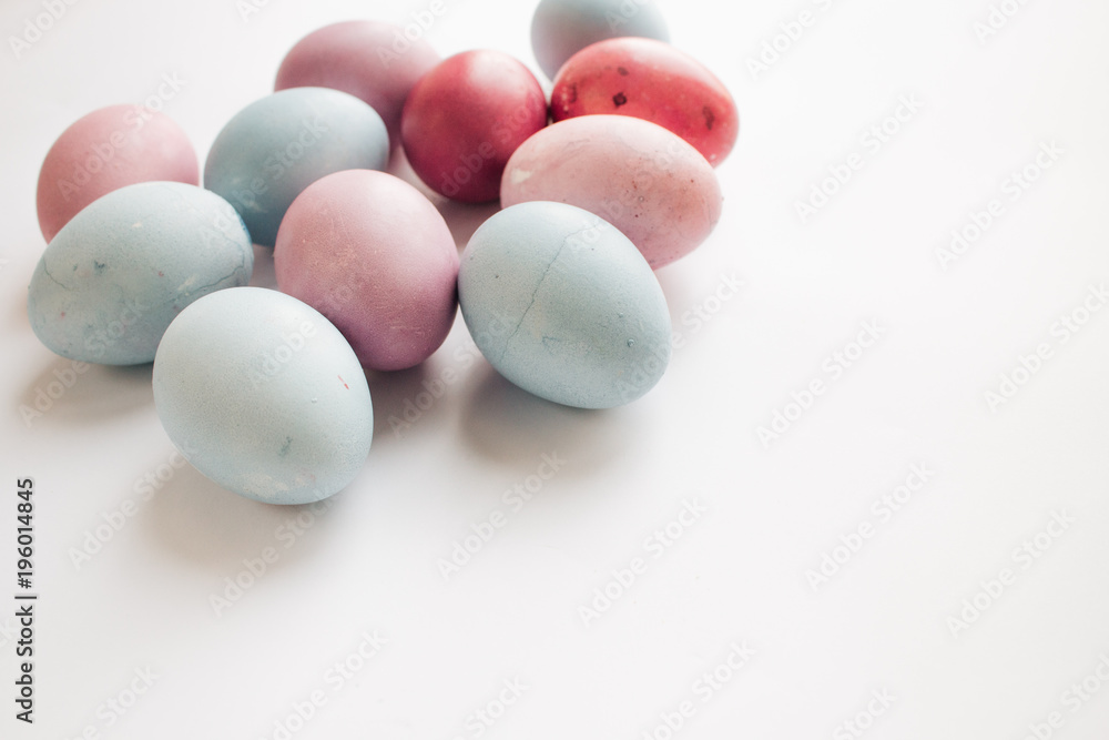 Painted Easter eggs on white background, festive background