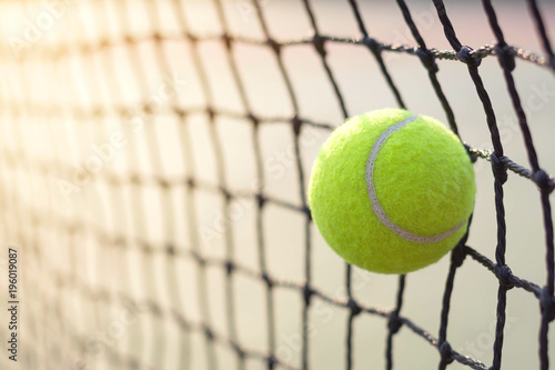 Close up tennis ball hitting to net on blur background © WK Stock Photo 