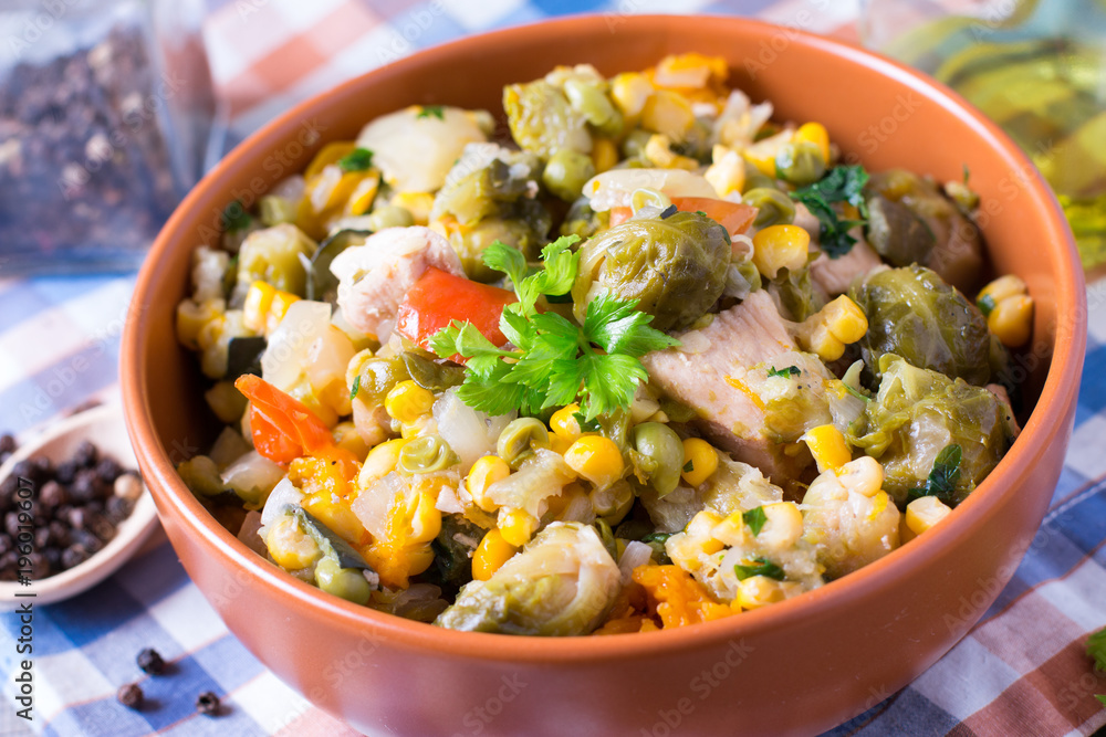 Vegetable stew. Stewed vegetables in in a plate on an old wooden table. Vegetable stew. Stewed vegetables in in a plate on an old wooden table.