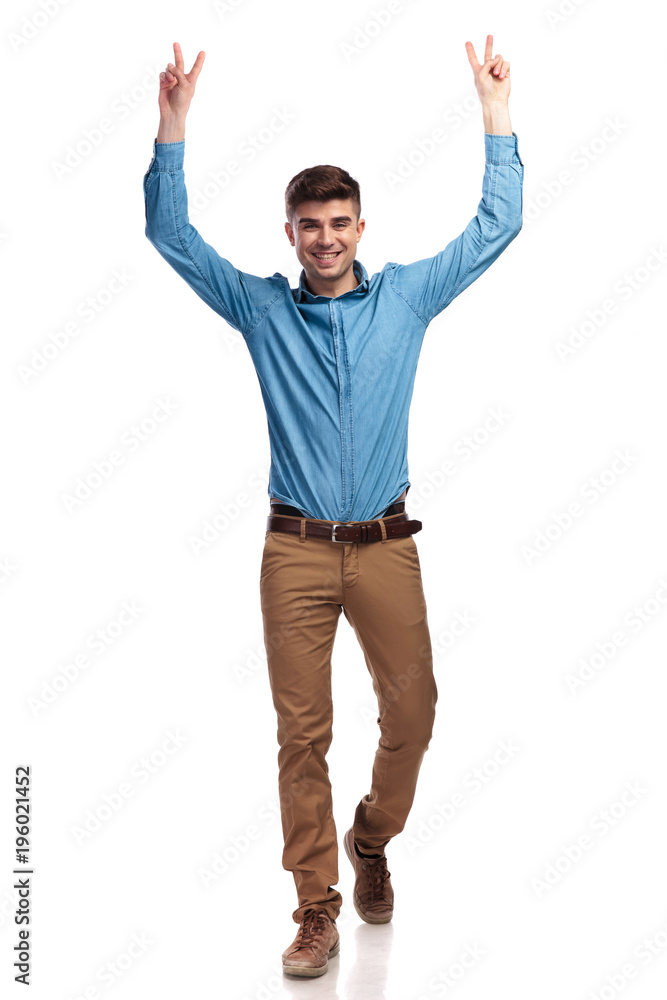 walking man making victory sign with hands in the air walking man making victory sign with hands in the air