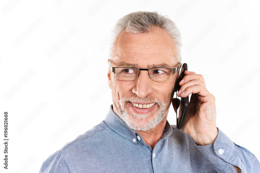Portrait of smiling mature man talking on smartphone isolated Portrait of smiling mature man talking on smartphone isolated