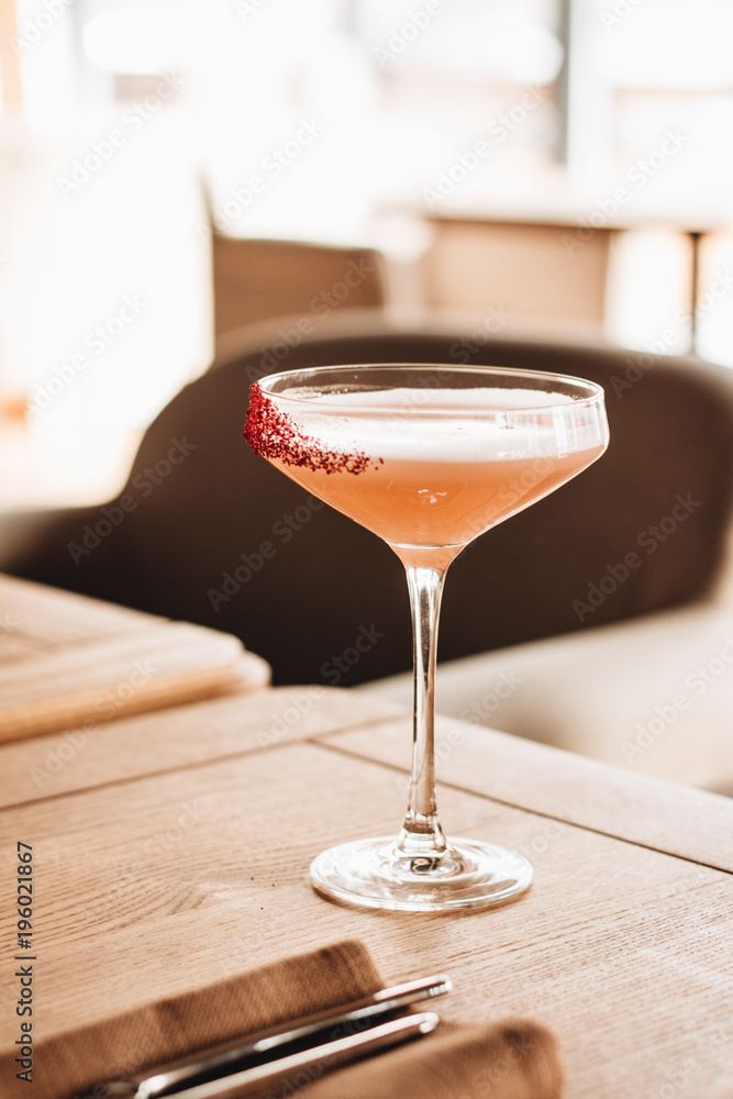 Delicious alcohol cocktail on wooden table