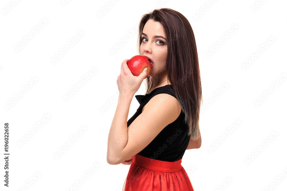 Beautiful young smiling woman holding an apple in her hands on a white background isolation Beautiful young smiling woman holding an apple in her hands on a white background isolation