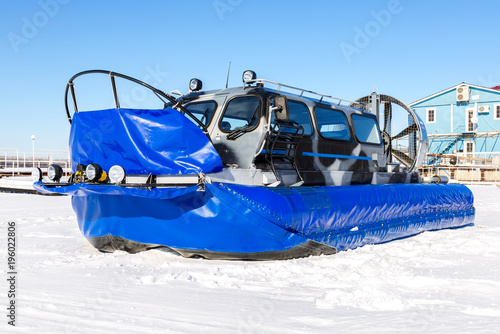 Bilde på lerret Passenger hovercraft transporter on the ice of river in winter day
