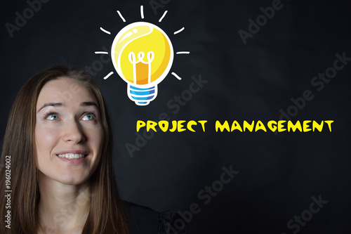 A businessman shows an inscription:PROJECT MANAGEMENT