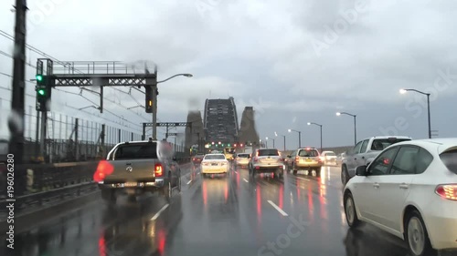 Wallpaper Mural SYDNEY - NOVEMBER 6, 2015: Driving on a rainy evening over Harbour Bridge. The city attracts 20 million people every year Torontodigital.ca