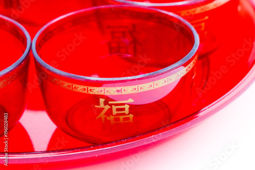 Close-up Chinese Red Tea Cupisolated on white background. It copy space and selection focus.Chinisei text in this image is it name “dring” photo