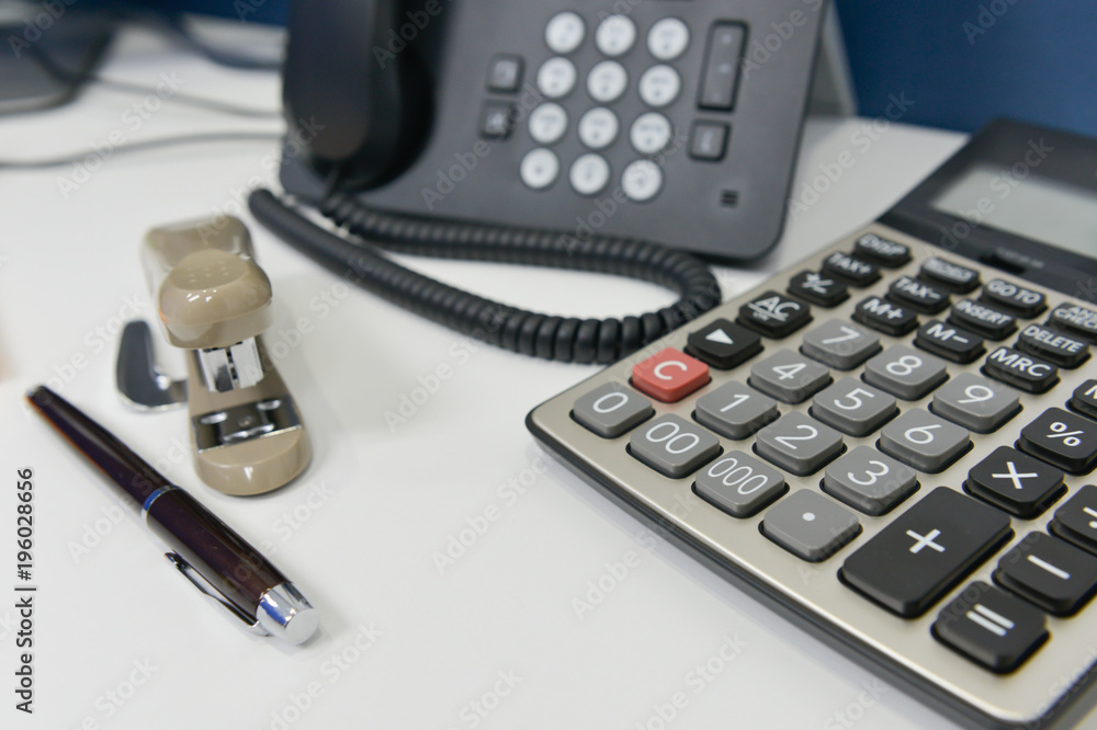 Office equipment with IP Phone, pen, stapler and calculator Office equipment with IP Phone, pen, stapler and calculator