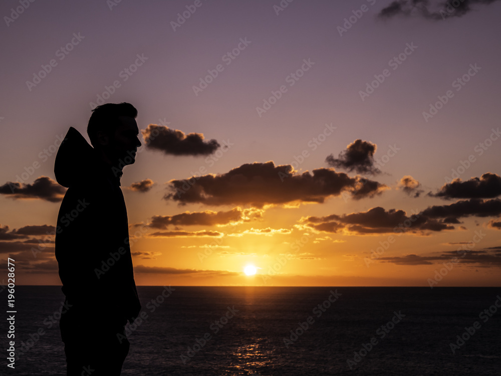 Man's silhouette in front of a gorgeous sunset