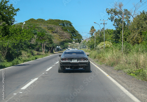 racing black car in Cumana city street