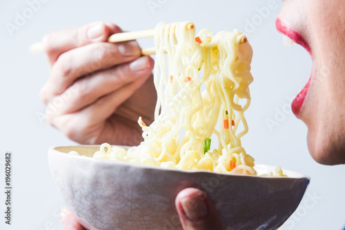 eating instant noodles