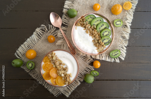 Natural healthy yogurt with muesli and fruit. photo