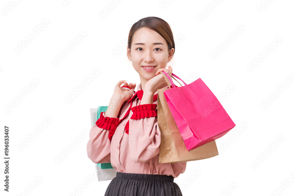 A girl with shopping bags. Shopping woman smiling. Isolated over white background. A girl with shopping bags. Shopping woman smiling. Isolated over white background.