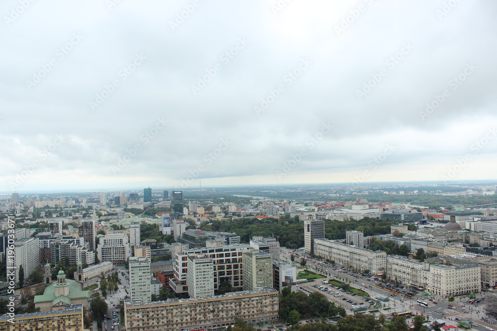 Warsaw, Poland - September 27: Top view on beautiful modern Warsaw. Great modern city below. Dark clouds.