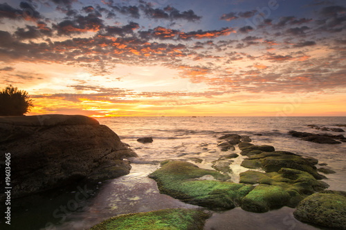 sunset seascape with natural coastal rocks. nature composition