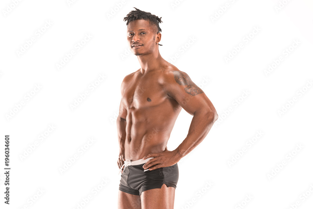 Fototapeta premium Fit young man with beautiful torso isolated on white background
