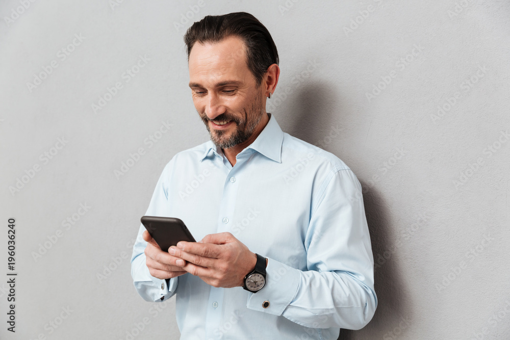 Portrait of a smiling mature man dressed in shirt Portrait of a smiling mature man dressed in shirt