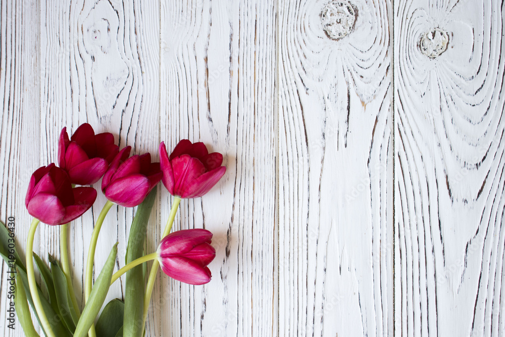 Colorful tulips on wooden table. Top view with copy space Colorful tulips on wooden table. Top view with copy space