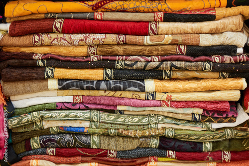 Wallpaper Mural Pile of colorful folded textile. Heap of cloth fabric Torontodigital.ca