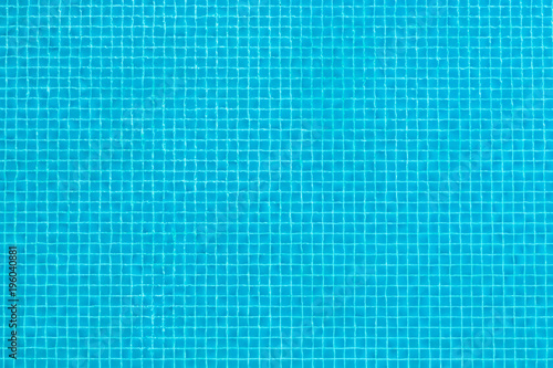 Aerial top view of transparent blue surface swimming pool texture abstract background.