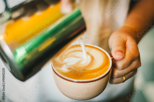 Coffee latte art in coffee shop. Vintage color tone