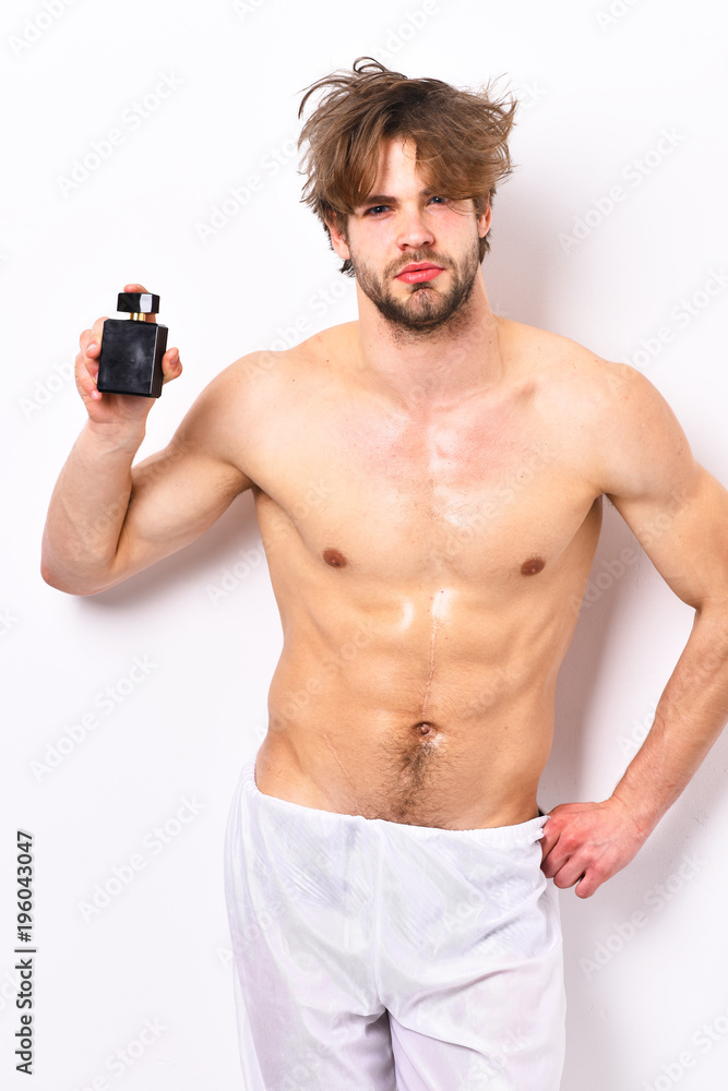 Muscular unshaven young man Muscular unshaven young man