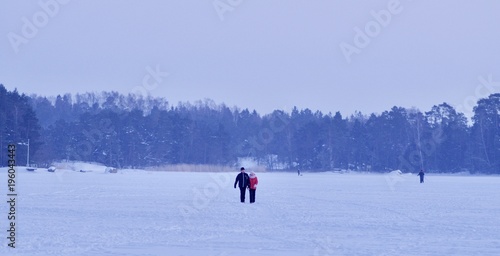 People standing on the frozen sea, Espoo, Finland