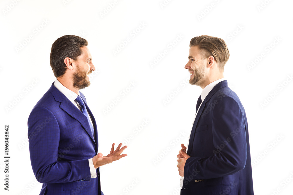 Businessmen with smiling faces and hands expression discussing problems Businessmen with smiling faces and hands expression discussing problems