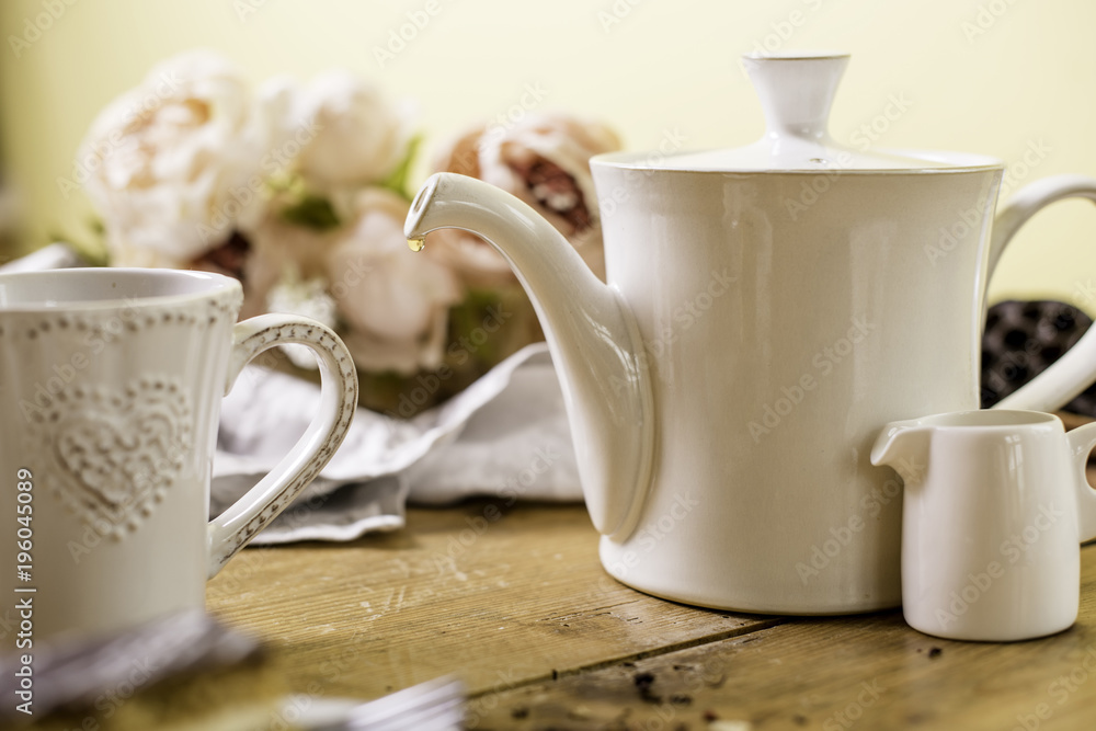 drop of tea coffee from a tea pot drop of tea coffee from a tea pot