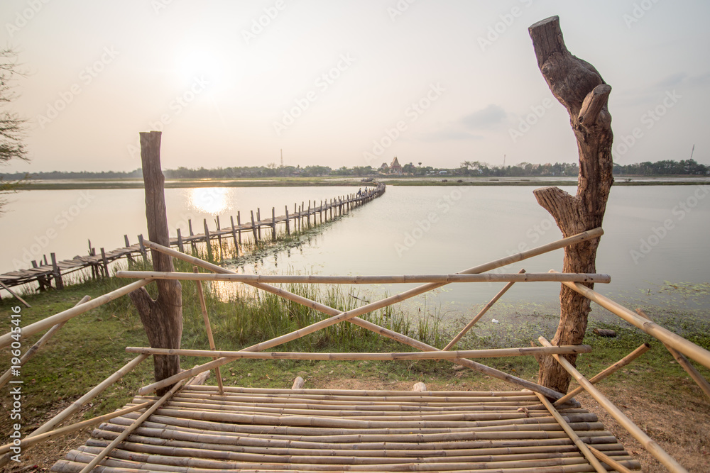 Obraz premium wood bridge cross a river