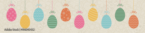 Pastel coloured banner with hanging Easter eggs on background with flowers. Vector.