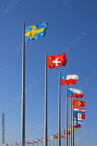 flags of the world on flagpoles