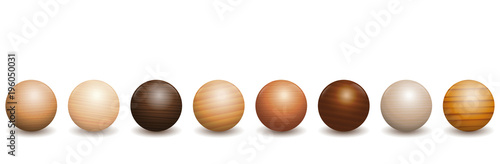 Wooden balls. Different species of wood types - variety of eight polished, varnished textured samples - brown, dark, gray, light, red or yellow decor models with reflections of light and shadow.