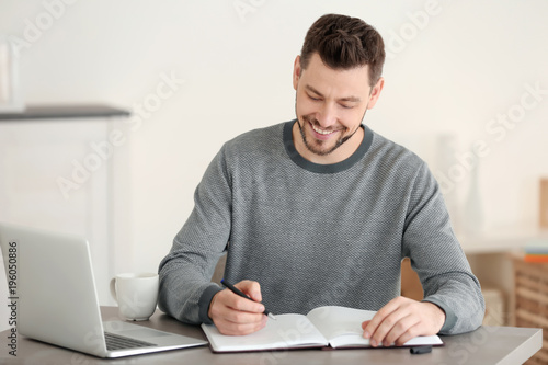 Young man working at home