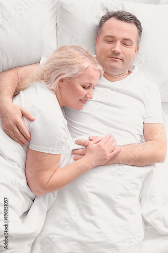 Senior couple in bed togeth...
