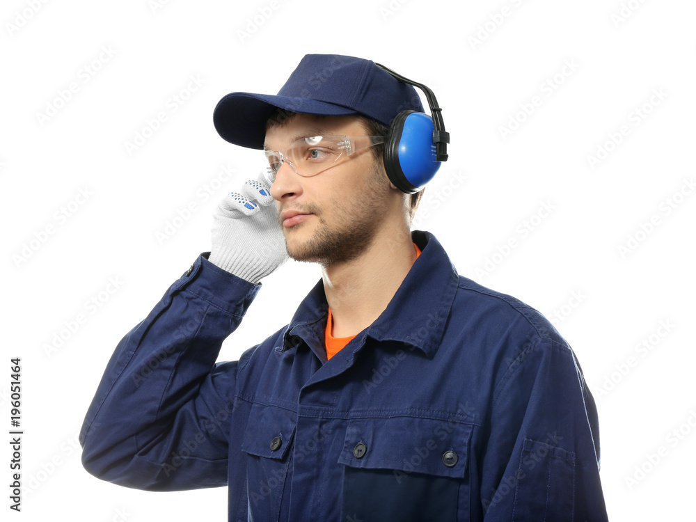 Male worker with headphones on white background. Hearing protection equipment Male worker with headphones on white background. Hearing protection equipment