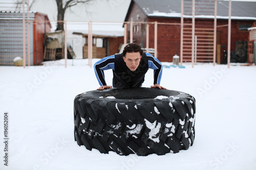 Young muscular man training...