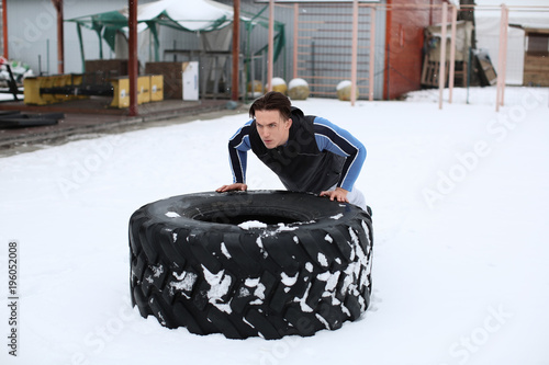 Young muscular man training...