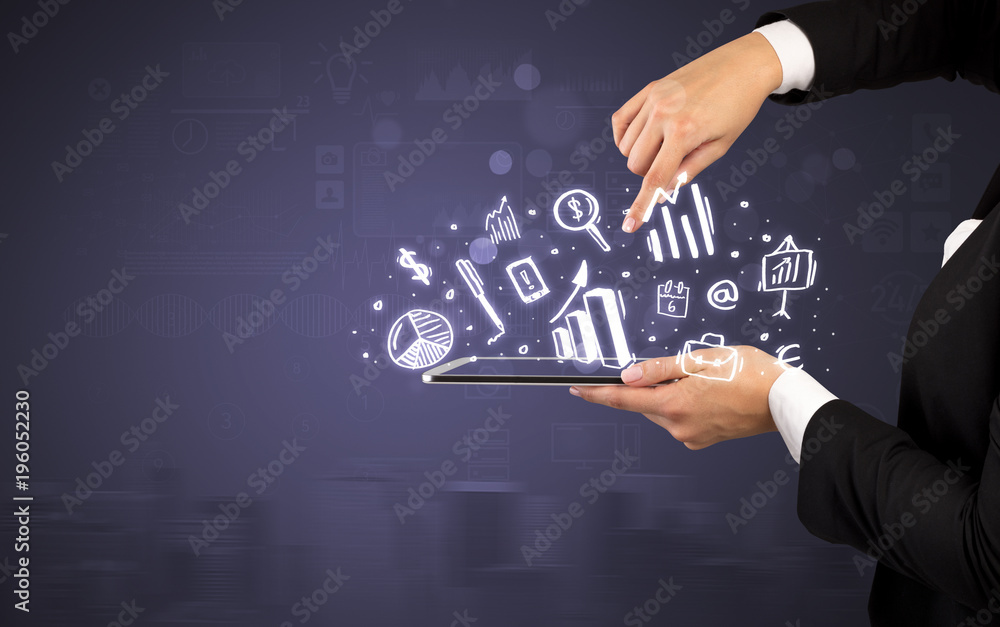 Hand holding tablet with chalk drawn symbols above Hand holding tablet with chalk drawn symbols above