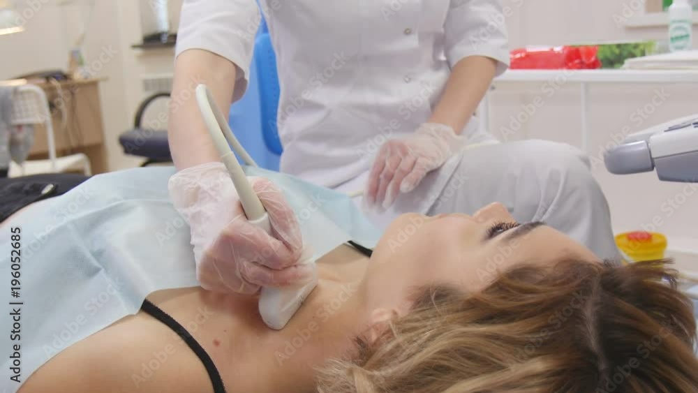 Doctor makes ultrasound tests beautiful girl Doctor makes ultrasound tests beautiful girl