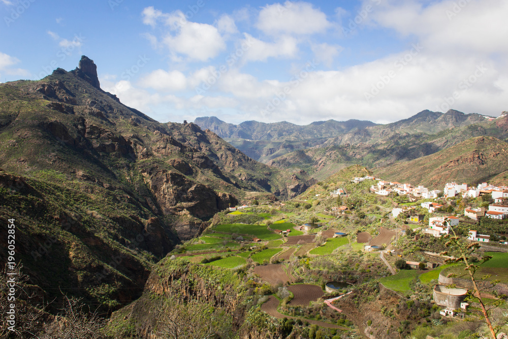 Splendid views of Roque Bentayga mountain from Tejeda town in Gran Canaria, Spain. Old town village with iconic mountain on background on sunny day