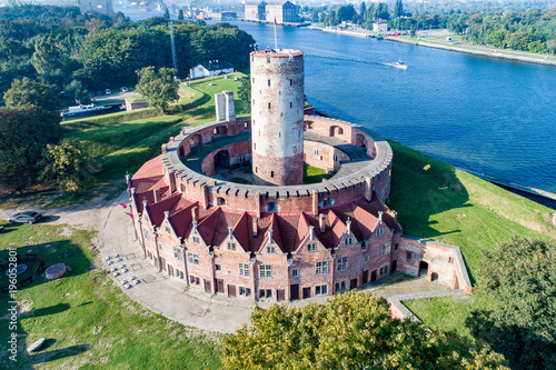 Medieval Wisloujscie Fortress with old lighthouse tower in port of Gdansk, Poland A unique monument of the fortification works. Aerial view