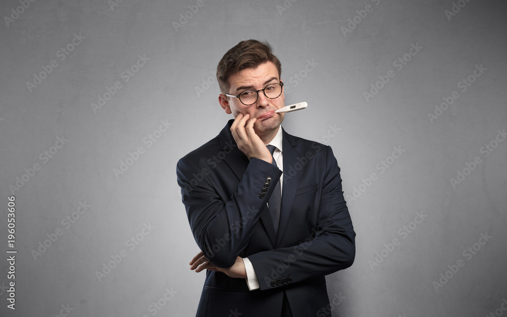 Businessman with thermometer and copy space Businessman with thermometer and copy space