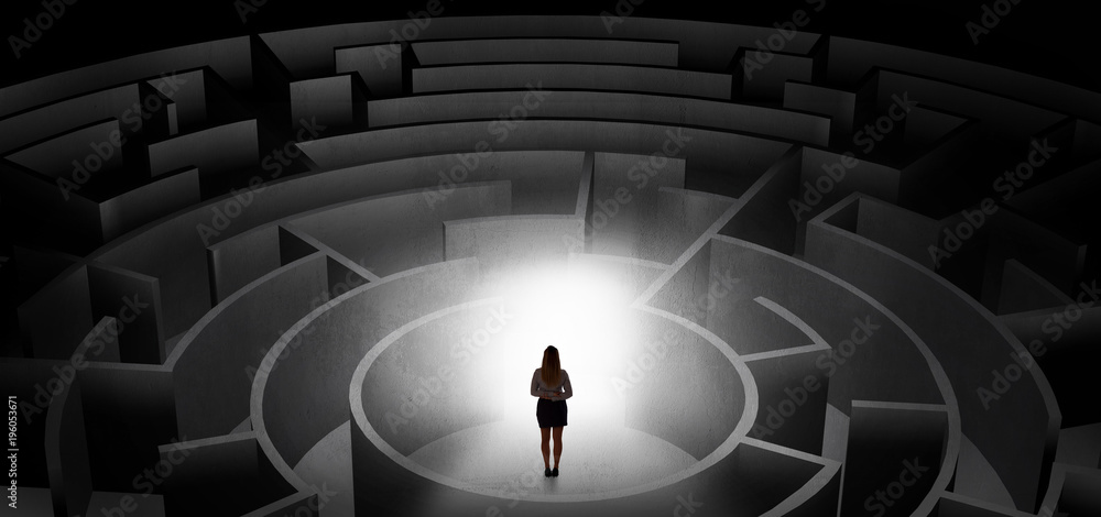 Woman choosing between entrances in a middle of a dark maze Woman choosing between entrances in a middle of a dark maze