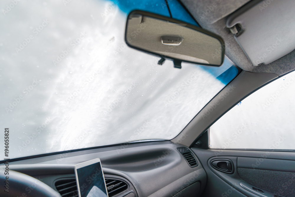 windshield of car in soap. car wash concept. view from inside windshield of car in soap. car wash concept. view from inside